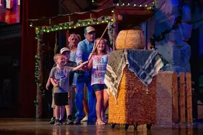 audience members on stage at The Comedy Barn
